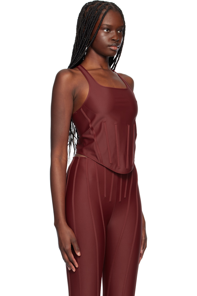 Stretch recycled nylon jersey tank top.

· Scoop neck
· Boning at front waist
· Curved hem
· Racer back
· Logo plaque at back collar

Supplier color: Red