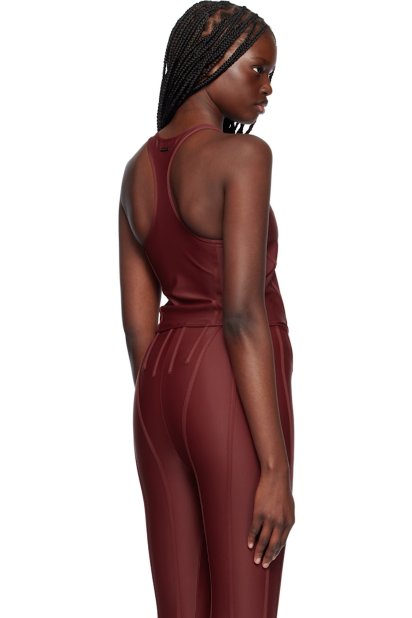Stretch recycled nylon jersey tank top.

· Scoop neck
· Boning at front waist
· Curved hem
· Racer back
· Logo plaque at back collar

Supplier color: Red