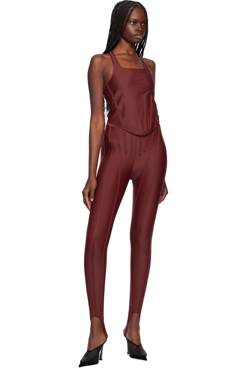 Stretch recycled nylon jersey tank top.

· Scoop neck
· Boning at front waist
· Curved hem
· Racer back
· Logo plaque at back collar

Supplier color: Red