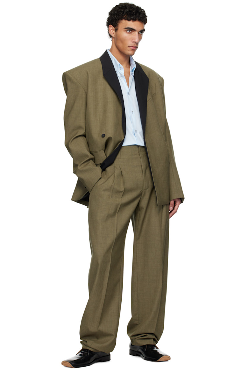 Wide-leg virgin wool canvas trousers.

· Belt loops
· Three-pocket styling
· Zip-fly
· Pleats at front
· Creased legs
· Unlined

Supplier color: Khaki