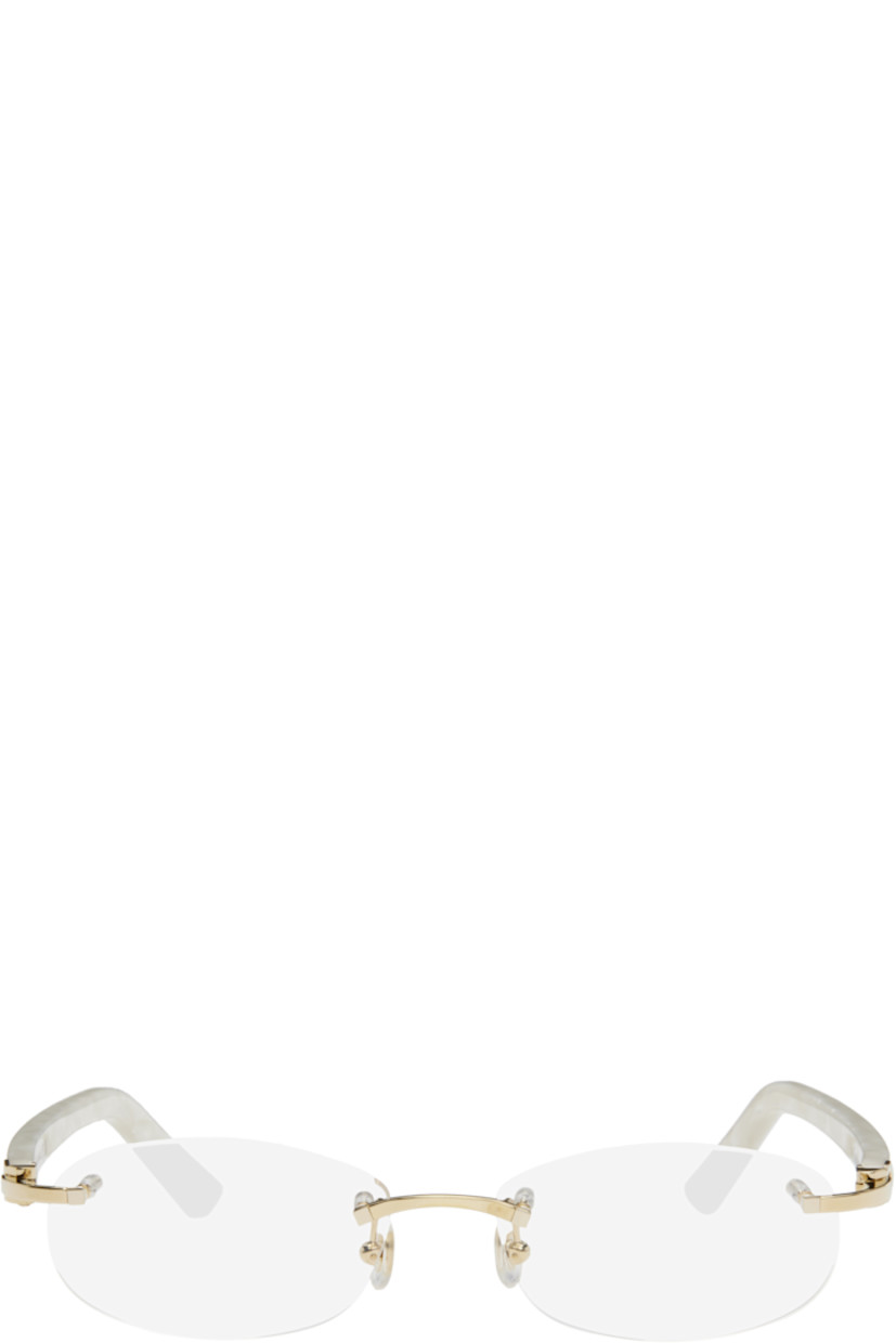 Oval rimless metal- and acetate-frame optical glasses in gold tone and white. 

· Adjustable rubber nose pads
· Logo hardware at temples
· Includes case 
· Size: 52.16 135

Supplier color: Gold
