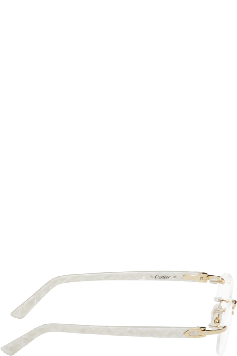 Oval rimless metal- and acetate-frame optical glasses in gold tone and white. 

· Adjustable rubber nose pads
· Logo hardware at temples
· Includes case 
· Size: 52.16 135

Supplier color: Gold