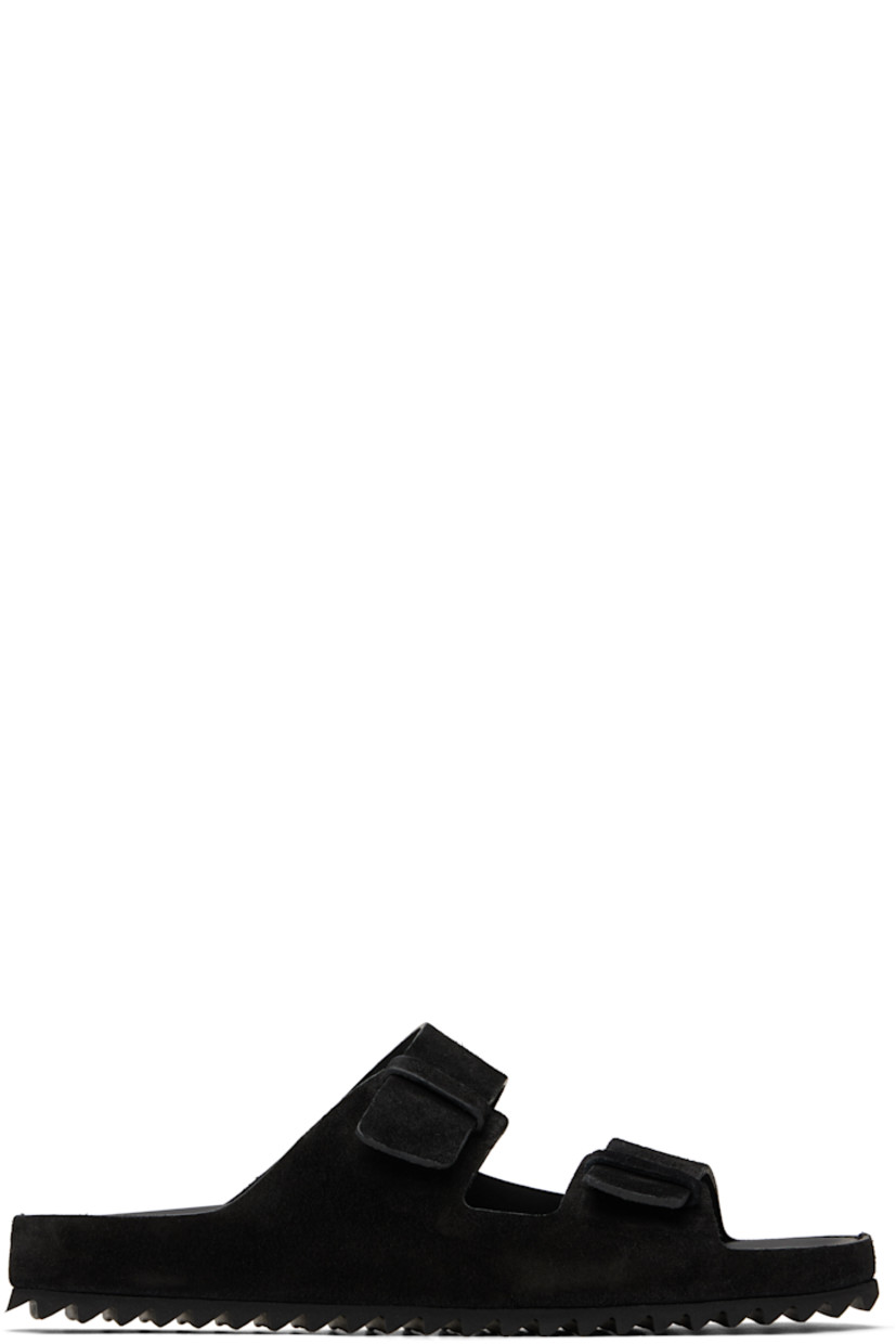 Handcrafted suede slip-on sandals in black.

· Open toe
�· Partially elasticized straps at vamp
· Logo stamp at molded leather footbed
· Treaded rubber sole

Supplier color: Light nero