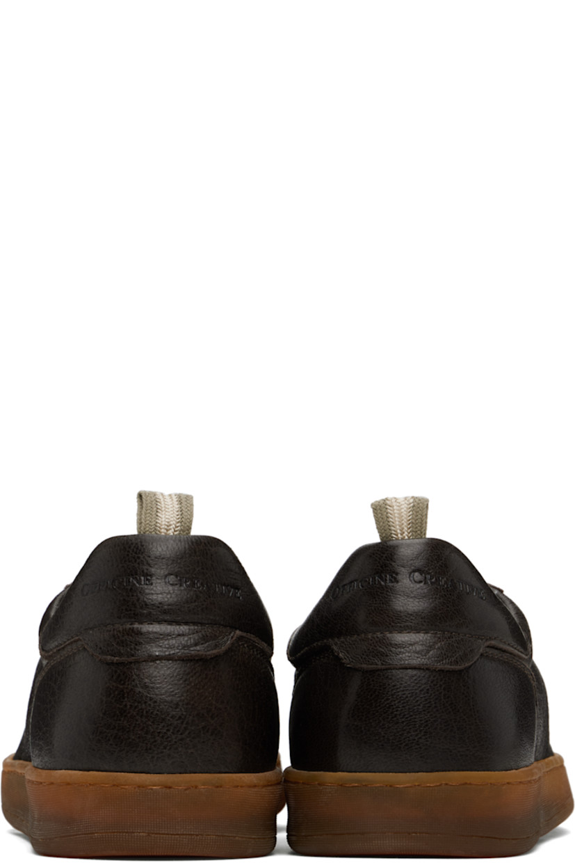Handcrafted low-top grained deerskin sneakers in brown. 

· Lace-up closure
· Logo embossed at padded tongue
· Pull-loop at padded collar 
· Logo embossed at heel tab 
· Suede lining 
· Treaded rubber sole 

Supplier color: Ebano