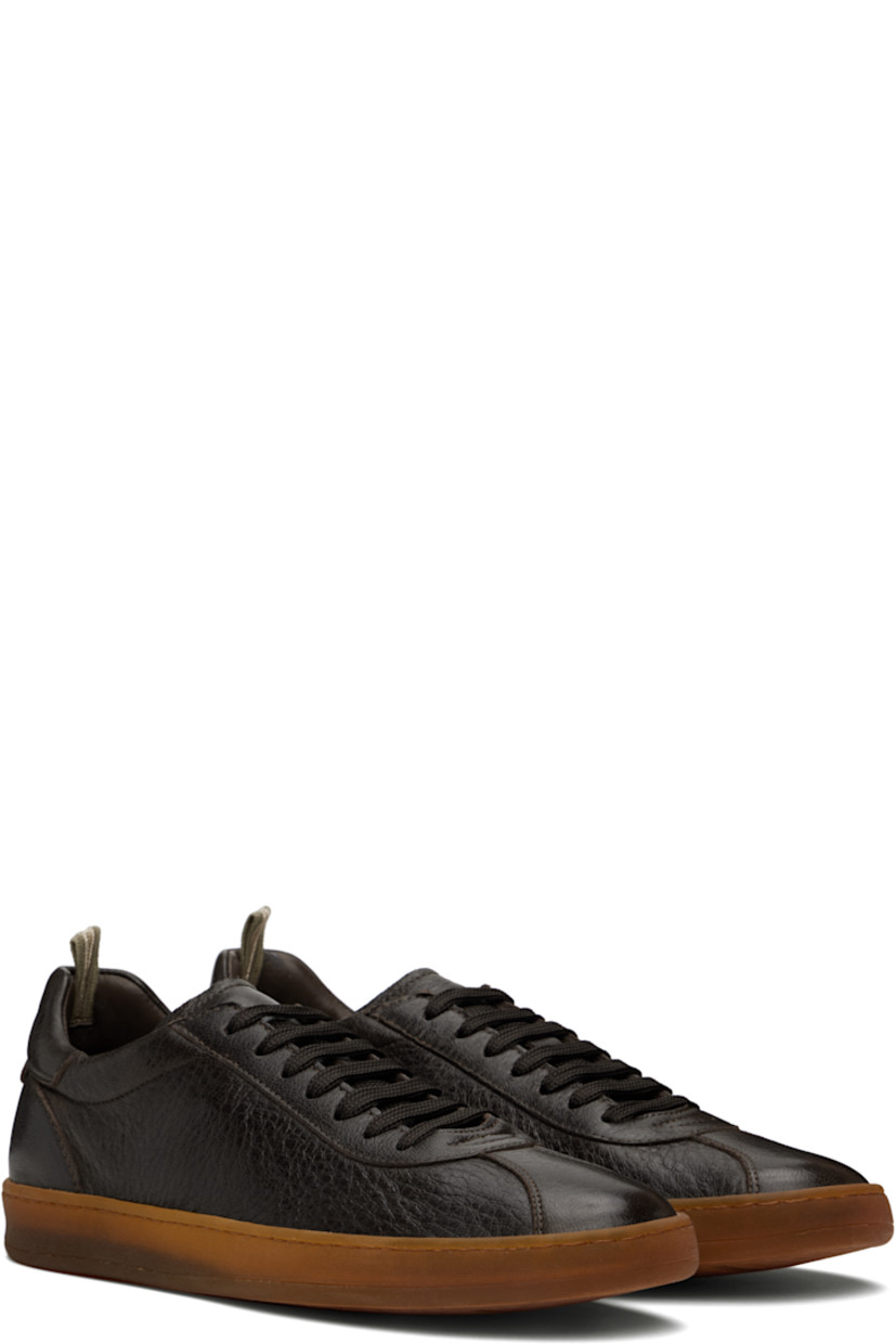 Handcrafted low-top grained deerskin sneakers in brown. 

· Lace-up closure
· Logo embossed at padded tongue
· Pull-loop at padded collar 
· Logo embossed at heel tab 
· Suede lining 
· Treaded rubber sole 

Supplier color: Ebano