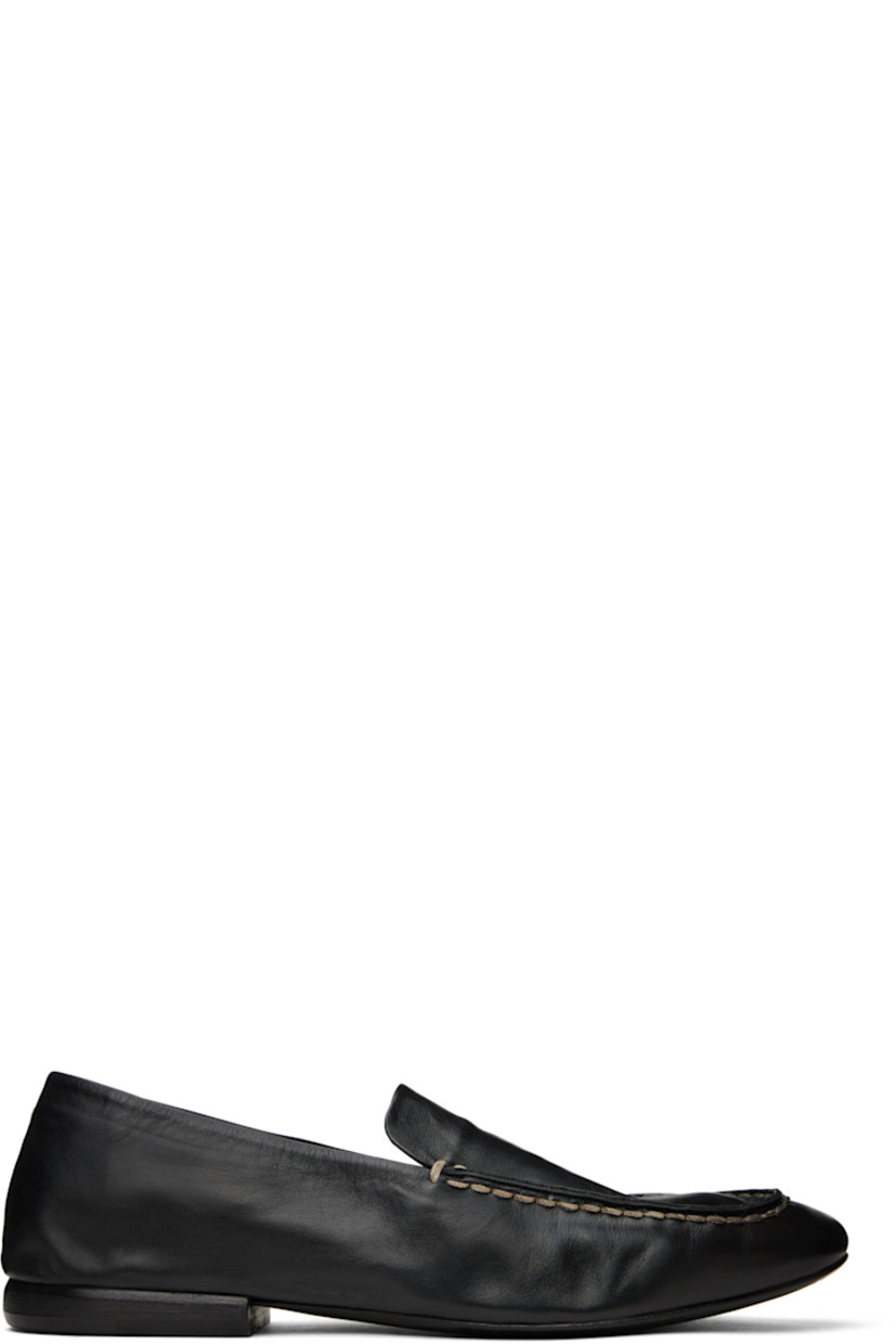 Crinkled grained calfskin loafers in black. 

· Topstitching at moc toe
· Logo embossed at padded footbed
· Suede and buffed leather lining
· Stacked leather heel with rubber injection
· Leather sole

Supplier color: Black