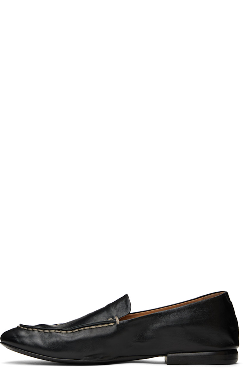 Crinkled grained calfskin loafers in black. 

· Topstitching at moc toe
· Logo embossed at padded footbed
· Suede and buffed leather lining
· Stacked leather heel with rubber injection
· Leather sole

Supplier color: Black