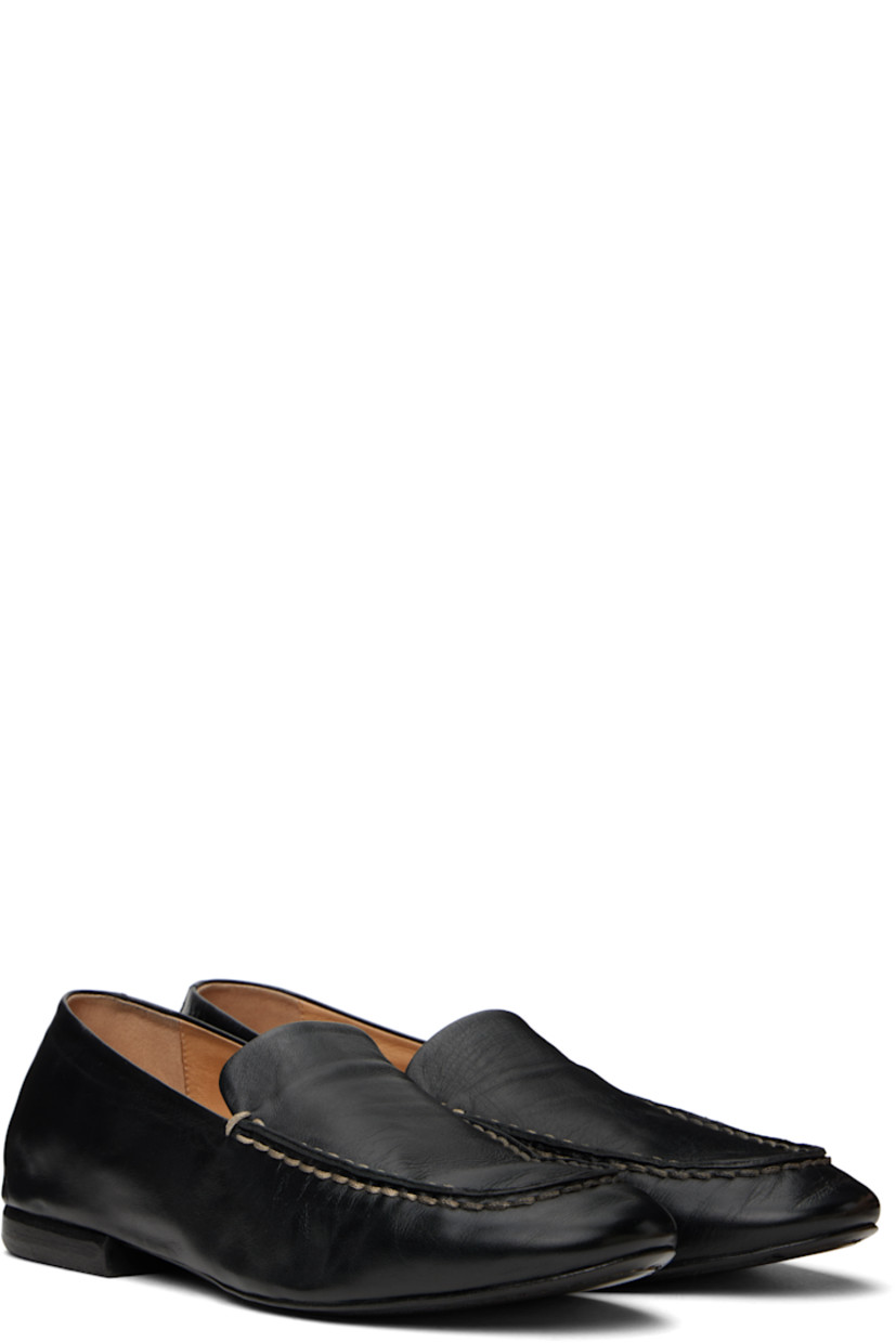 Crinkled grained calfskin loafers in black. 

· Topstitching at moc toe
· Logo embossed at padded footbed
· Suede and buffed leather lining
· Stacked leather heel with rubber injection
· Leather sole

Supplier color: Black