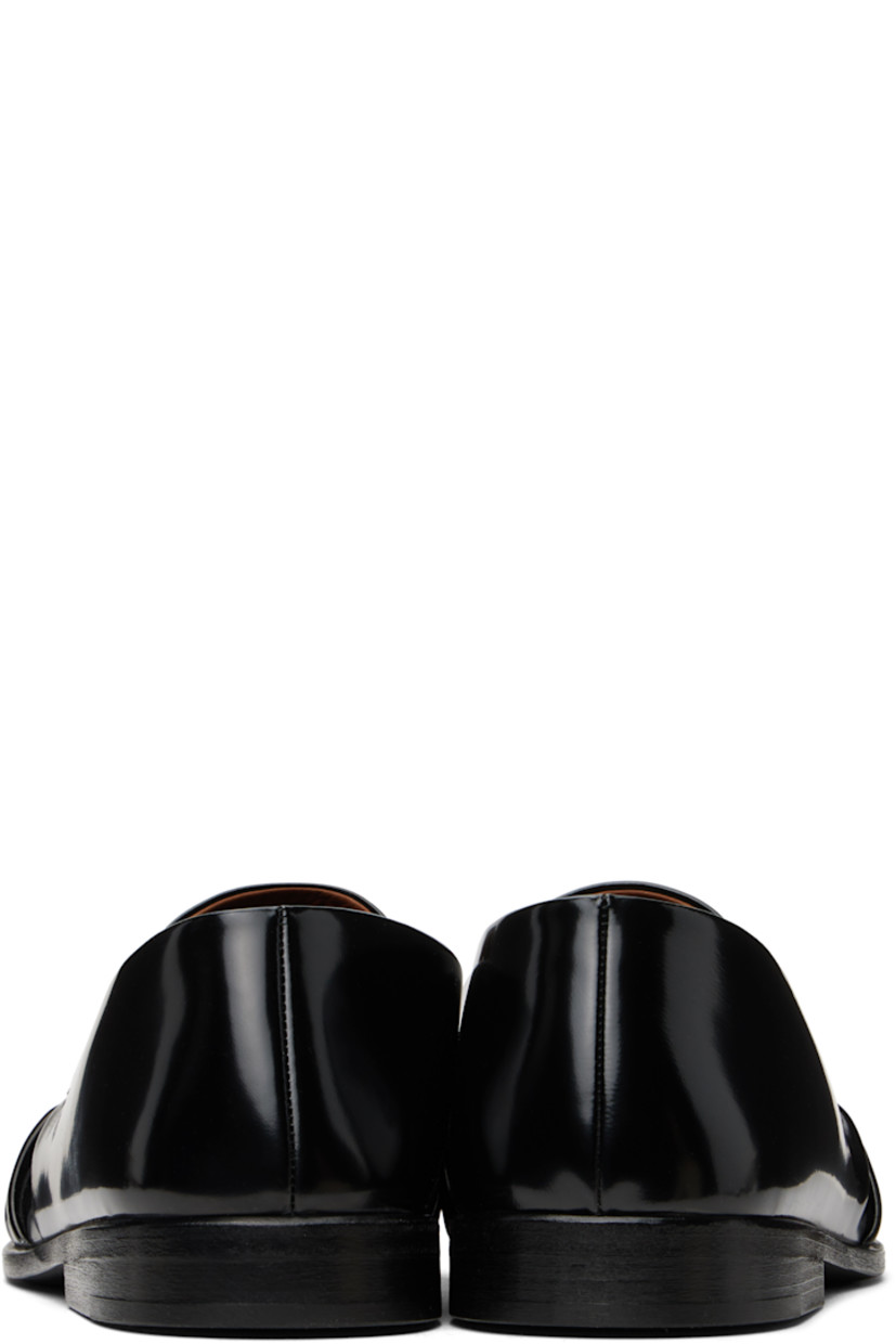 Handcrafted patent calfskin loafers in black. 

· Gathering at moc toe
· Suede and buffed leather lining
· Stacked leather heel with rubber injection
· Hand-dyed leather sole

Supplier color: Black