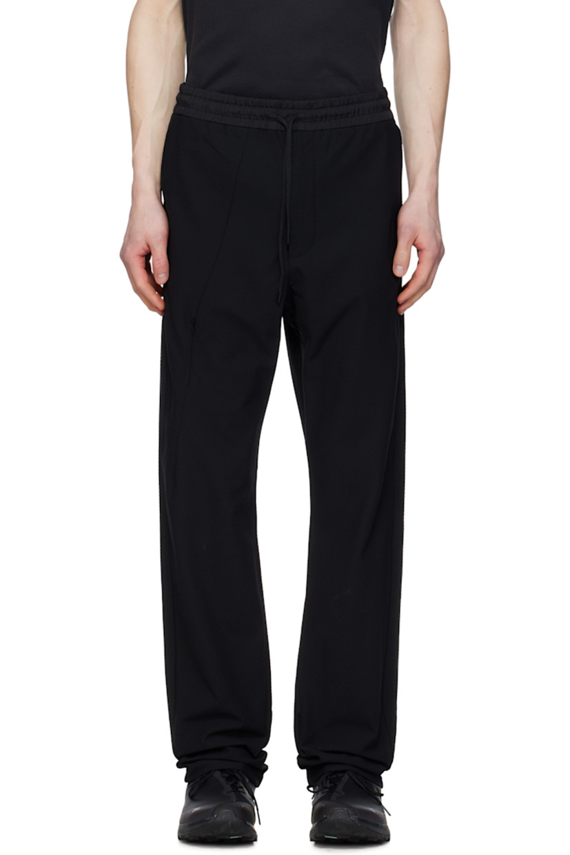 Lightweight TEXBRID™ polyester jersey track pants. Jacquard check pattern throughout.

· Drawstring at elasticized waistband
· Three-pocket styling
· Zip fly
· Dart at front leg and back cuffs
· Concealed zip pocket at leg
· Partially elasticized cuffs

Part of the 8.0 collection.  

Supplier color: Black