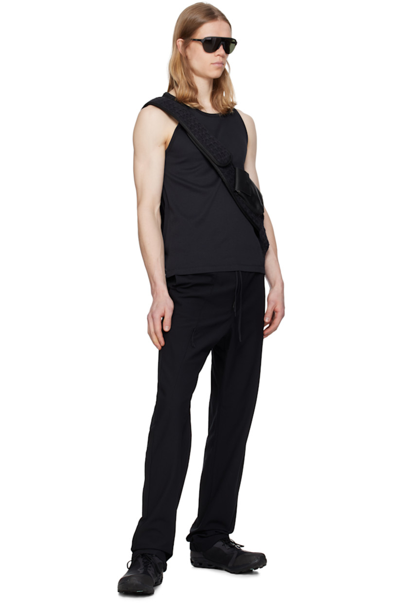 Lightweight TEXBRID™ polyester jersey track pants. Jacquard check pattern throughout.

· Drawstring at elasticized waistband
· Three-pocket styling
· Zip fly
· Dart at front leg and back cuffs
· Concealed zip pocket at leg
· Partially elasticized cuffs

Part of the 8.0 collection.  

Supplier color: Black