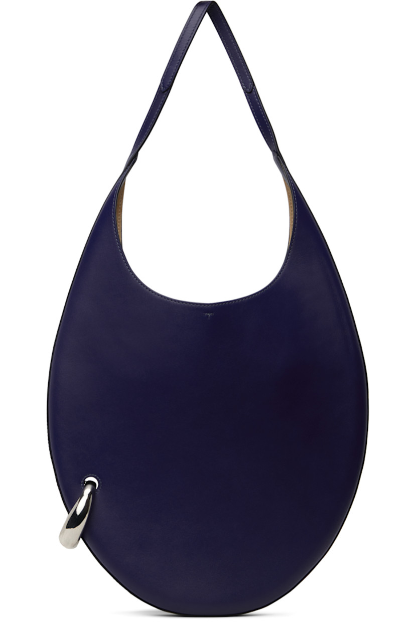 Buffed leather shoulder bag in navy.

· Fixed shoulder strap
· Silver-tone O-ring at side
· Self-tie closure
· Zip pocket at interior
· Faux-suede lining
· H12" x W12.5" x D1"
· Total height: H23"
 
Supplier color: Ballpoint blue