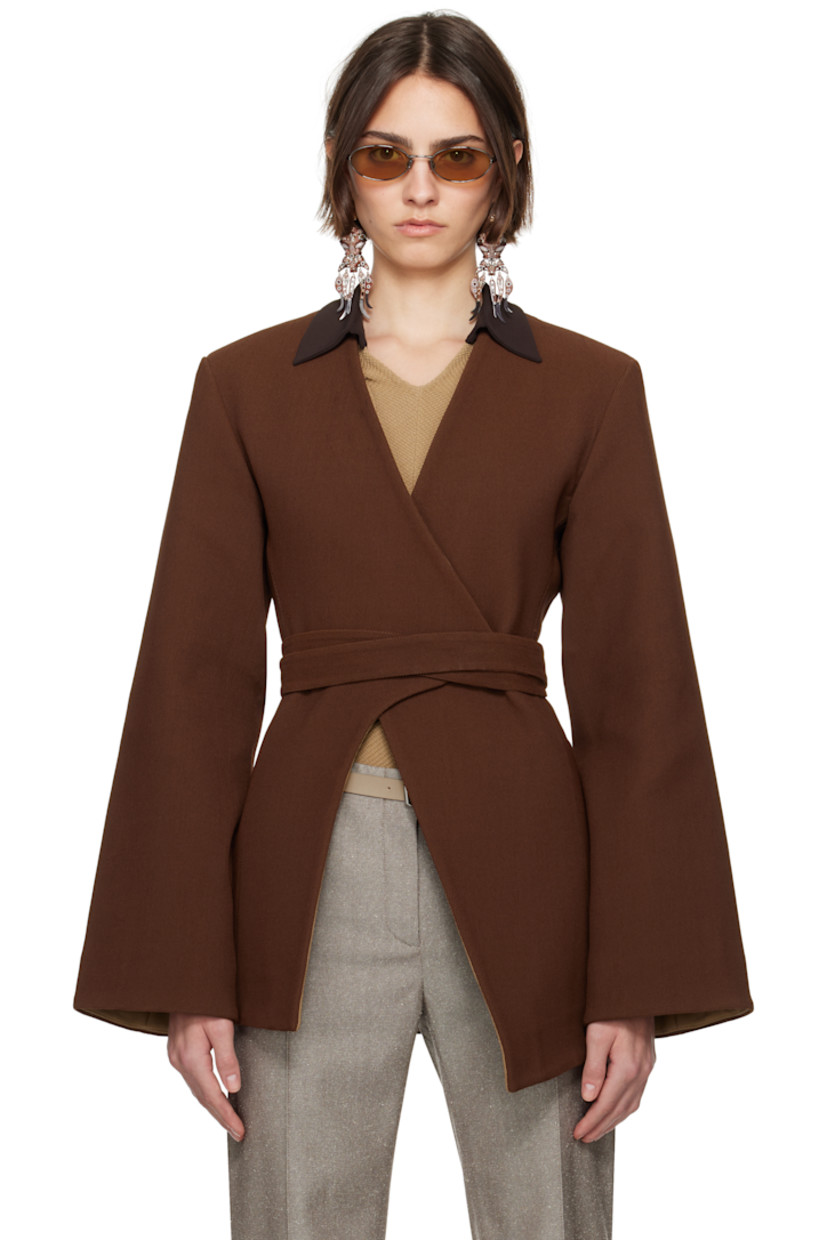 Stretch nylon-blend piqué blazer.

· Wrap construction
· Y-neck
· Hook-eye wraparound belt
· Asymmetric hem
· Padded shoulders
· Darts at back
· Partial plain-woven lining

Supplier color: Spiced mocha
