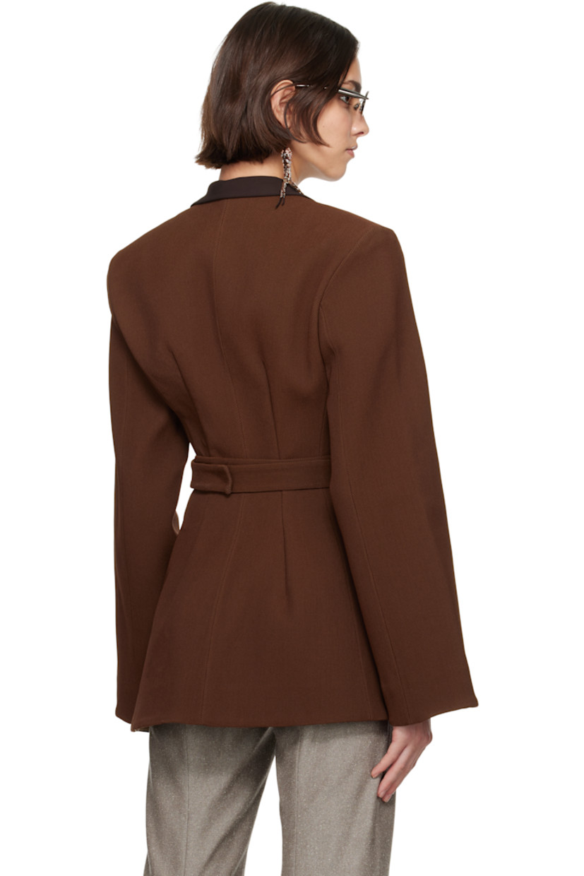 Stretch nylon-blend piqué blazer.

· Wrap construction
· Y-neck
· Hook-eye wraparound belt
· Asymmetric hem
· Padded shoulders
· Darts at back
· Partial plain-woven lining

Supplier color: Spiced mocha