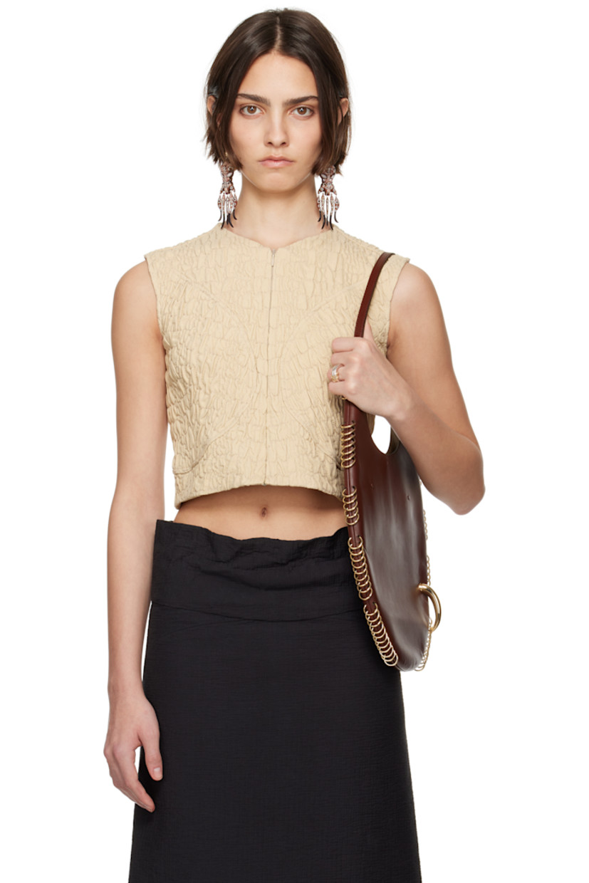 Quilted plain-woven wool- and silk-blend top.

· Paneled construction
· Crewneck
· Zip closure at front and back
· Cropped hem
· Full stretch mesh lining

Supplier color: Bora sand