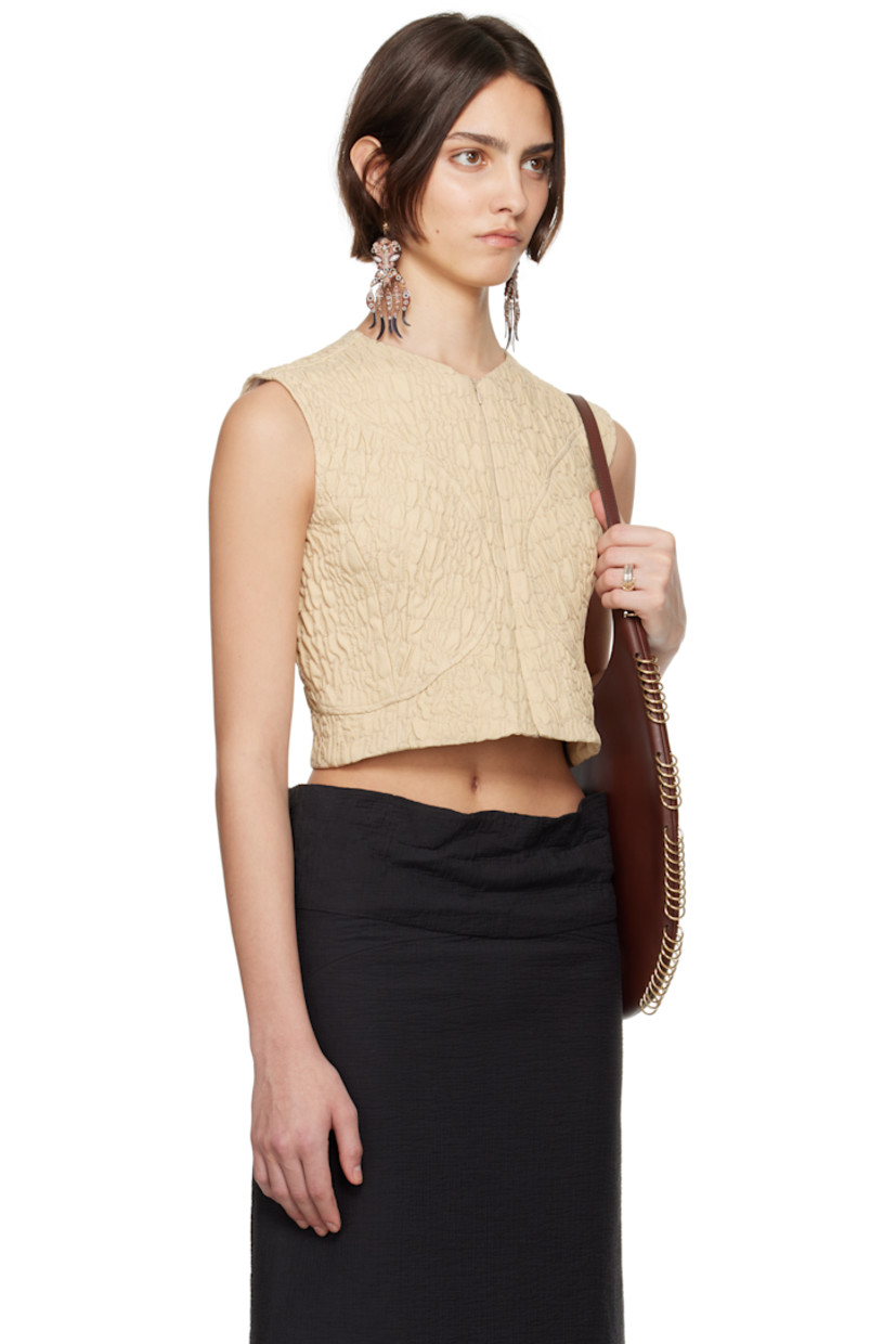 Quilted plain-woven wool- and silk-blend top.

· Paneled construction
· Crewneck
· Zip closure at front and back
· Cropped hem
· Full stretch mesh lining

Supplier color: Bora sand