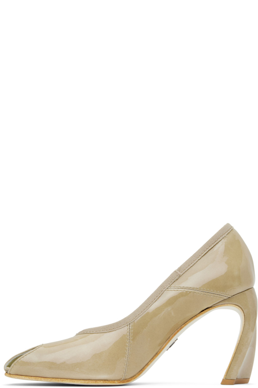 Patent leather heels in beige.

· Offset peep toe
· Grosgrain trim at collar
· Buffed goatskin and suede lining
· Covered sculptural heel with rubber injection
· Silver-tone logo hardware at nubuck sole
· Heel: H3.5"
 
Supplier color: Palo santo