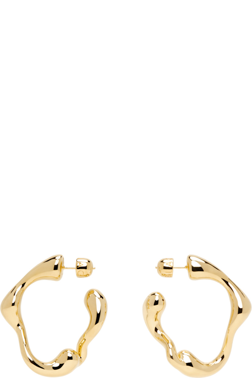 Pair of open hoop earrings in 18k gold-plated recycled sterling silver. 

· Post-stud fastening 
· D1.25"

Supplier color: 18k gold plated