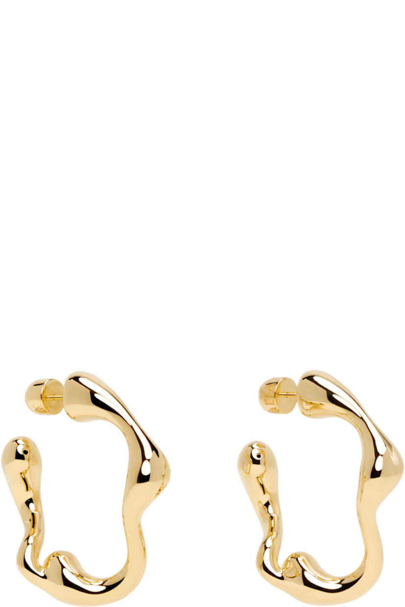 Pair of open hoop earrings in 18k gold-plated recycled sterling silver. 

· Post-stud fastening 
· D1.25"

Supplier color: 18k gold plated