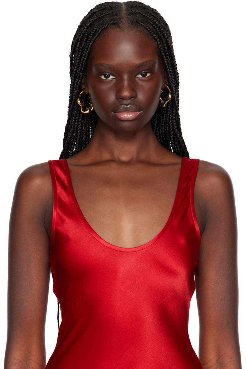 Pair of open hoop earrings in 18k gold-plated recycled sterling silver. 

· Post-stud fastening 
· D1.25"

Supplier color: 18k gold plated