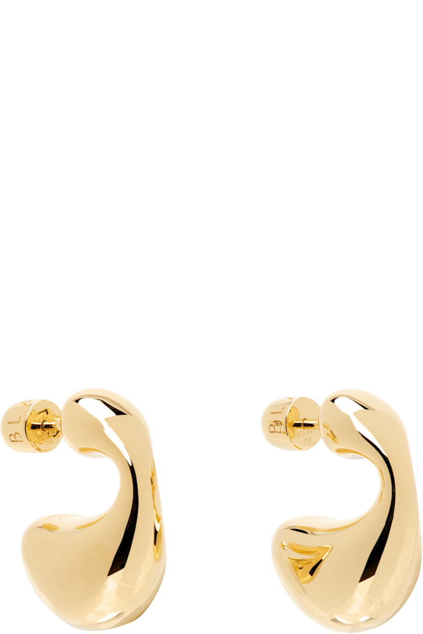 Pair of hoop earrings in 18k gold-plated sterling silver. 

· Post-stud fastening
· H1" x D0.25"

Supplier color: Sterling silver