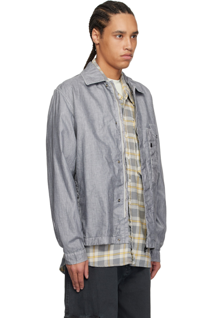 Garment-dyed and waxed linen chambray overshirt.

· Spread collar
· Zip closure with press-stud placket
· Logo-embroidered flap pocket at chest
· Welt pockets
· Concealed elasticized drawstring at hem
· Dart at adjustable press-stud barrel cuffs
· Vent at yoke
· Flap pocket and patch pockets at interior 
· Partial mesh lining
· Logo-engraved black hardware

Supplier color: Limestone