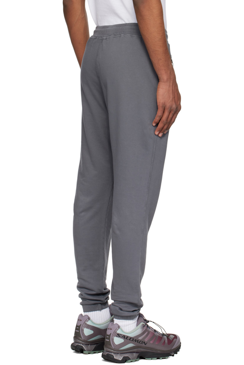 Garment-dyed French terry sweatpants. 

· Drawstring at waistband
· Two-pocket styling
· Mock fly
· Logo printed at leg
· Elasticized cuffs

Supplier color: Smoked pearl