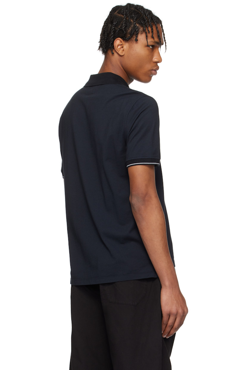 Garment-dyed cotton- and nylon-blend piqué polo.

· Rib-knit spread collar and cuffs
· Two-button placket
· Embroidered logo patch at chest
· Tennis-tail hem
· Stripe at cuffs

Supplier color: Black