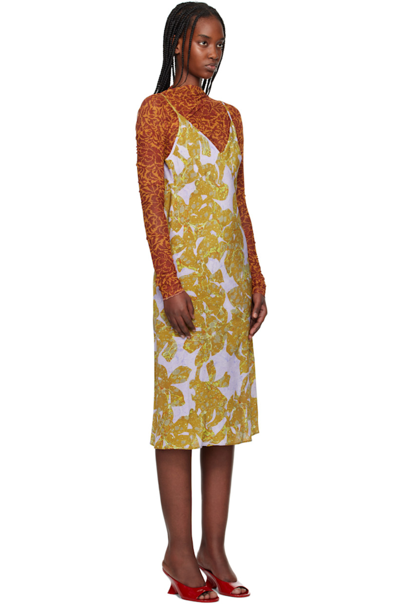 Sheer stretch nylon mesh midi dress.  

· Graphic pattern printed throughout
· V-neck
· Adjustable spaghetti shoulder straps
· Unlined 

Supplier color: Ocra