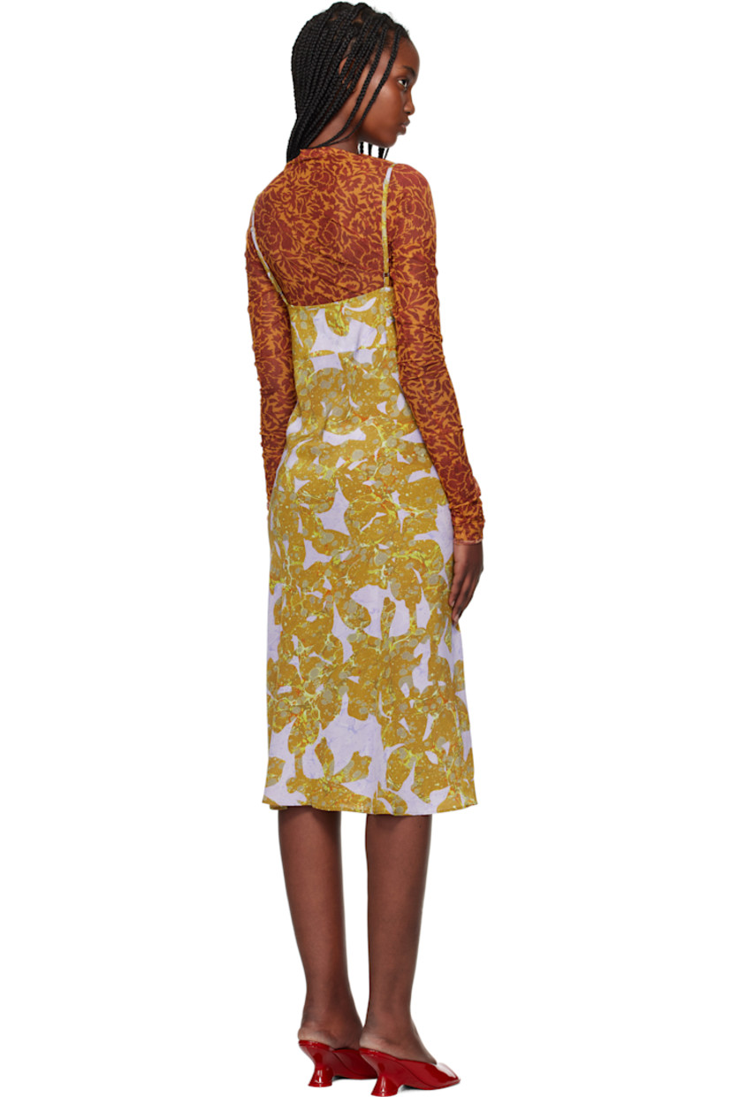 Sheer stretch nylon mesh midi dress.  

· Graphic pattern printed throughout
· V-neck
· Adjustable spaghetti shoulder straps
· Unlined 

Supplier color: Ocra