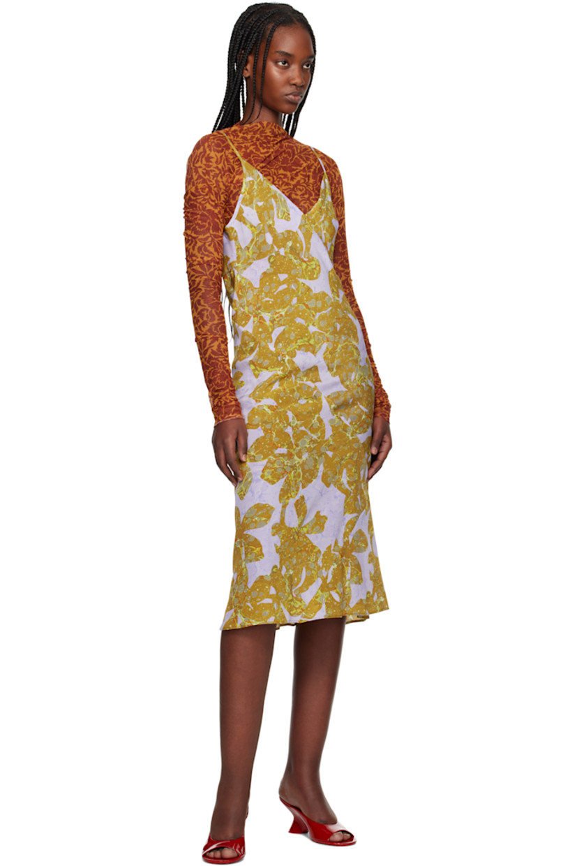 Sheer stretch nylon mesh midi dress.  

· Graphic pattern printed throughout
· V-neck
· Adjustable spaghetti shoulder straps
· Unlined 

Supplier color: Ocra