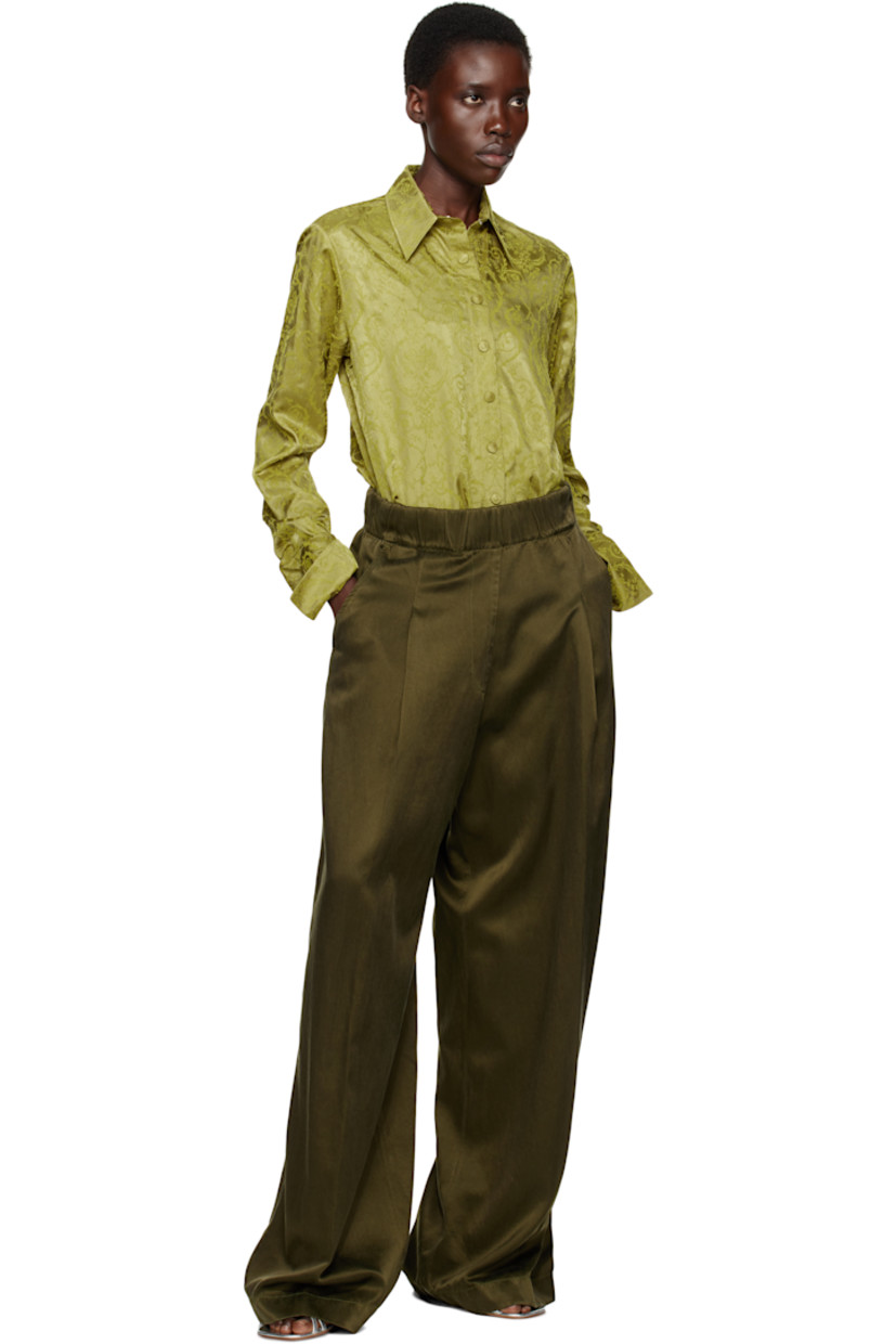 Garment-dyed cupro- and cotton-blend twill satin trousers.

· Loose-fit and wide-leg
· High-rise
· Concealed drawstring at elasticized waistband
· Three-pocket styling
· Mock fly
· Pleats at front

Supplier color: Khaki