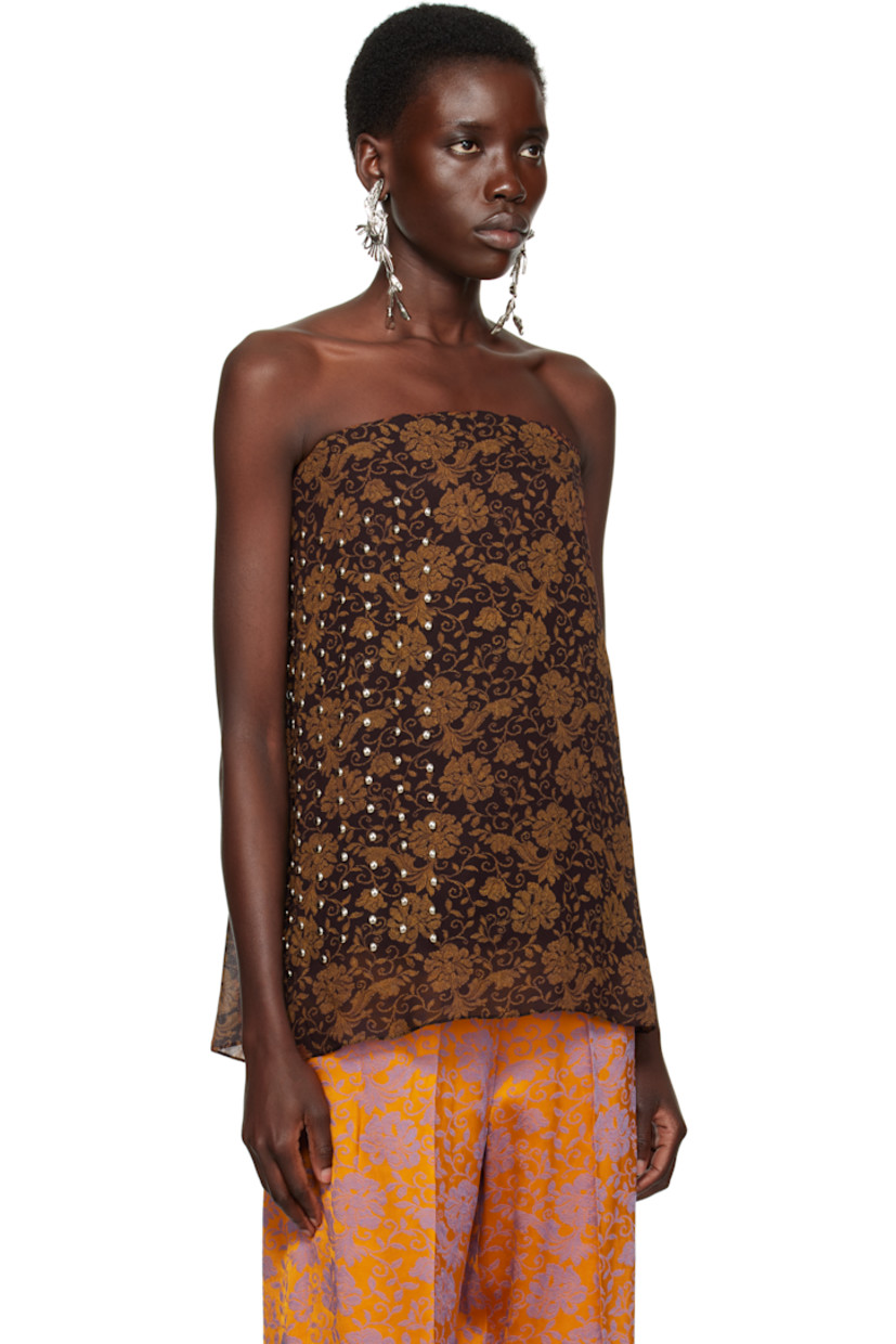 Viscose crêpe top. Floral pattern printed throughout.

· Layered construction
· Straight neck
· Boning at front and back
· Studs at side seam
· Gathering and concealed hook-eye closure at back 
· Corset-style underlay with elasticized hem 
· Full satin lining 

Supplier color: Dark brown
