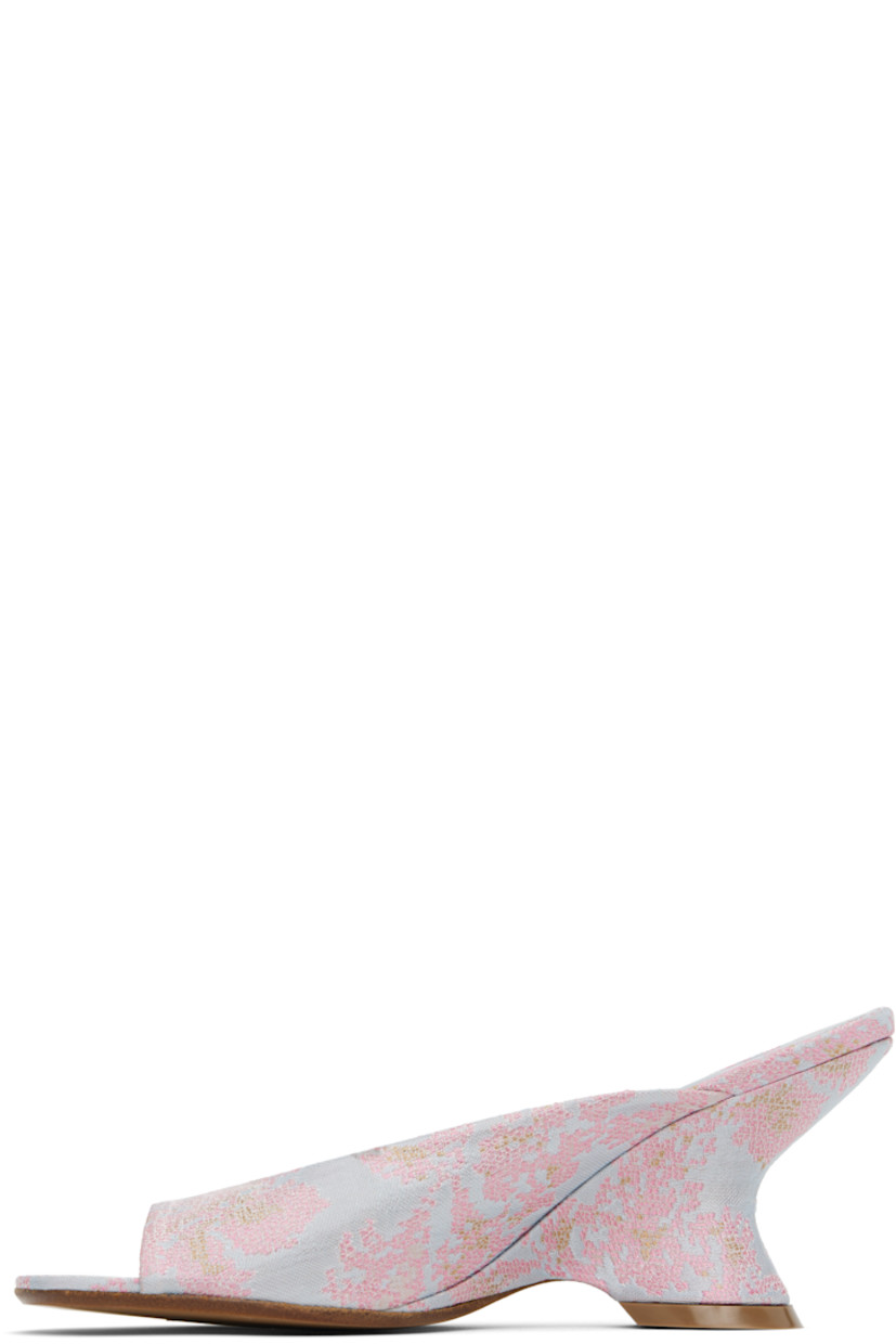 Damask slip-on heeled sandals in blue.

· Jacquard floral pattern throughout
· Open toe
· Logo stamp at padded leather footbed
· Covered wedge heel with rubber injection
· Polished leather sole
· Heel: H2.75"

Supplier color: Pale blue
