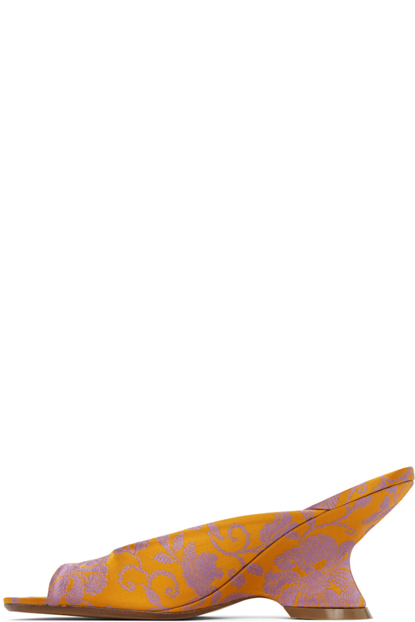 Damask slip-on heeled sandals in orange.

· Jacquard floral pattern throughout
· Open toe
· Logo stamp at padded leather footbed
· Covered wedge heel with rubber injection
· Polished leather sole
· Heel: H2.75"

Supplier color: Mandarin