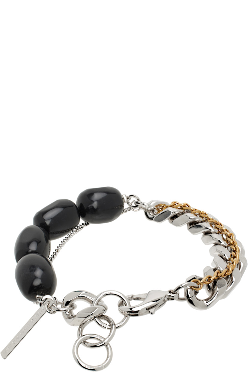 Handcrafted tiered curb chain bracelet in silver- and gold-tone brass.

· Beaded black stones at length
· Logo plaque at adjustable lobster-clasp fastening
· L9"

Supplier color: Black