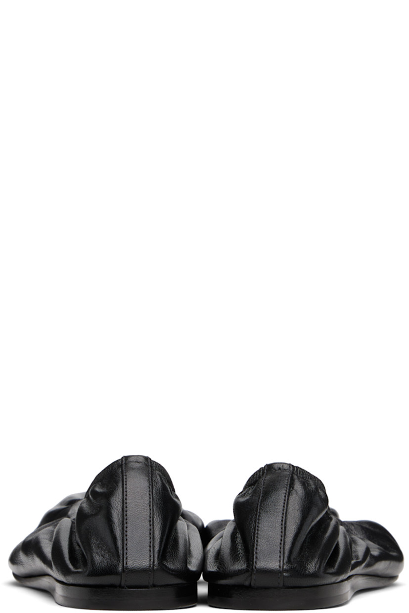 Grained lambskin ballerina flats in black.

· Pointed toe
· Elasticized collar
· Nubuck sole with rubber injections

Supplier color: Black