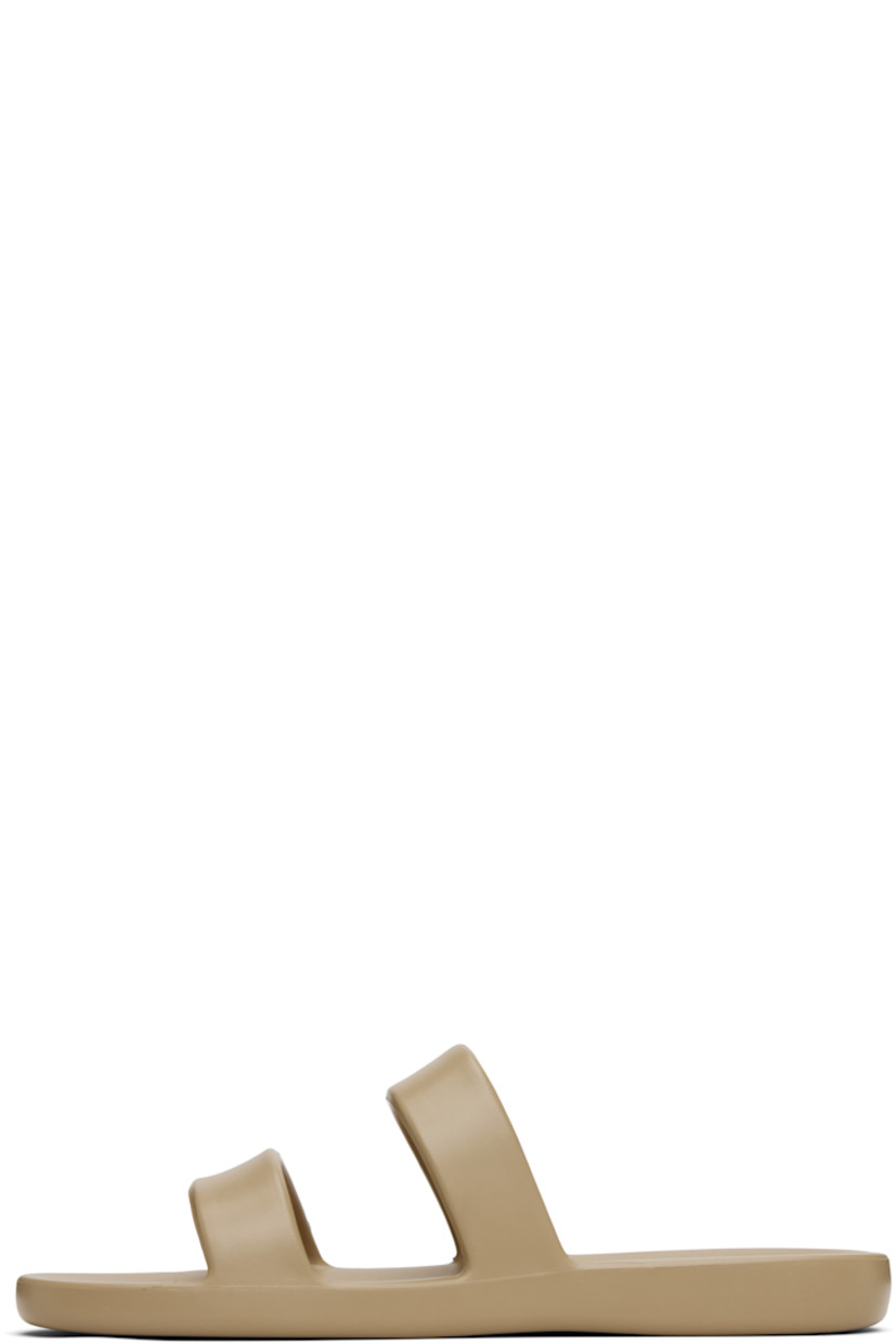 Lightweight foam rubber flat sandals in taupe.

· Open toe
· Logo embossed at molded footbed
· Treaded foam rubber sole

Supplier color: Iron grey