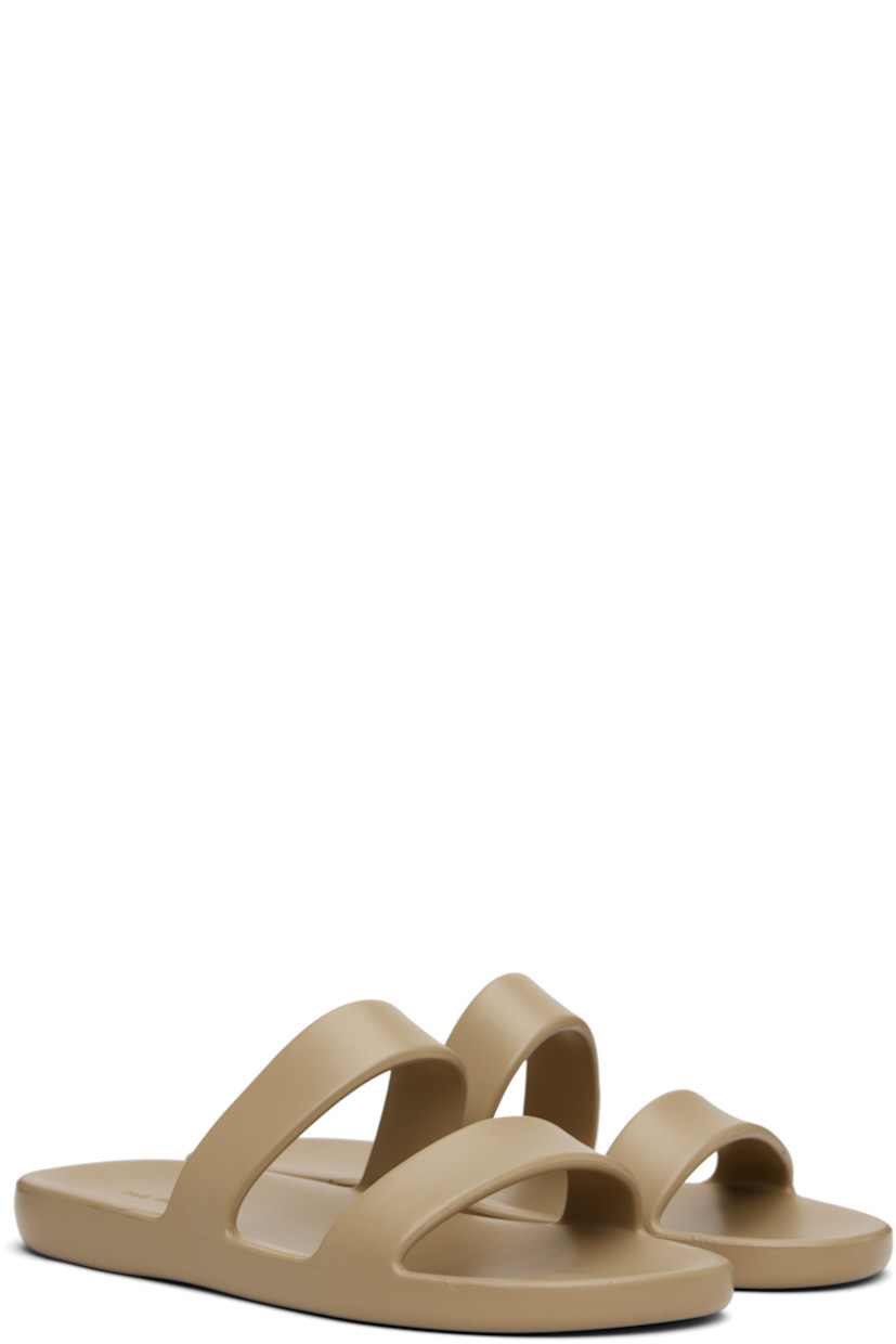 Lightweight foam rubber flat sandals in taupe.

· Open toe
· Logo embossed at molded footbed
· Treaded foam rubber sole

Supplier color: Iron grey