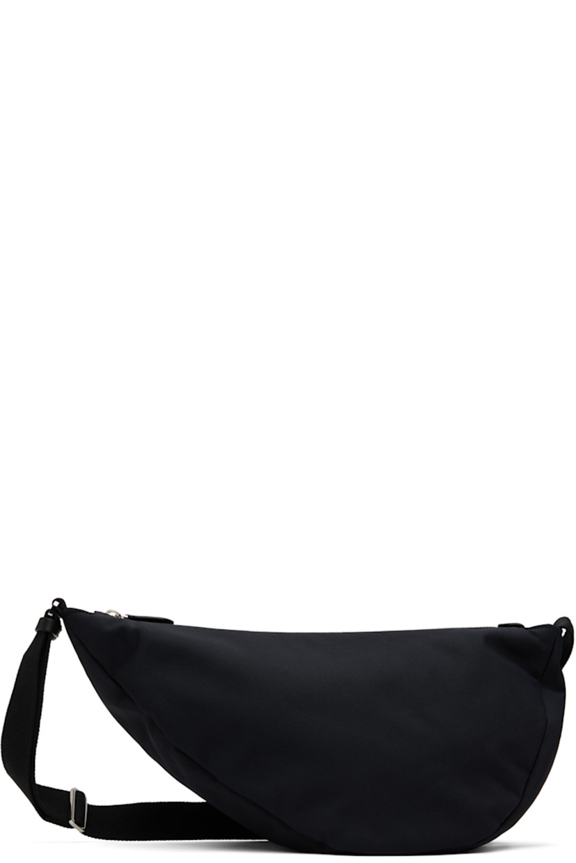 Lightweight nylon- and cotton-blend canvas messenger bag in black.

· Adjustable crossbody strap
· Zip closure
· Fully lined
· H8" x W14" x D6.5"

Supplier color: Black