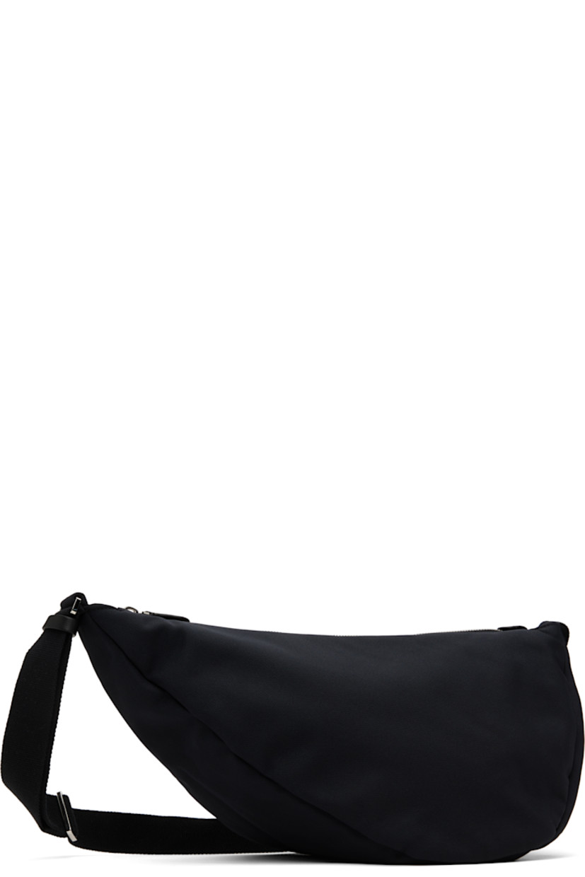 Lightweight nylon- and cotton-blend canvas messenger bag in black.

· Adjustable crossbody strap
· Zip closure
· Fully lined
· H8" x W14" x D6.5"

Supplier color: Black