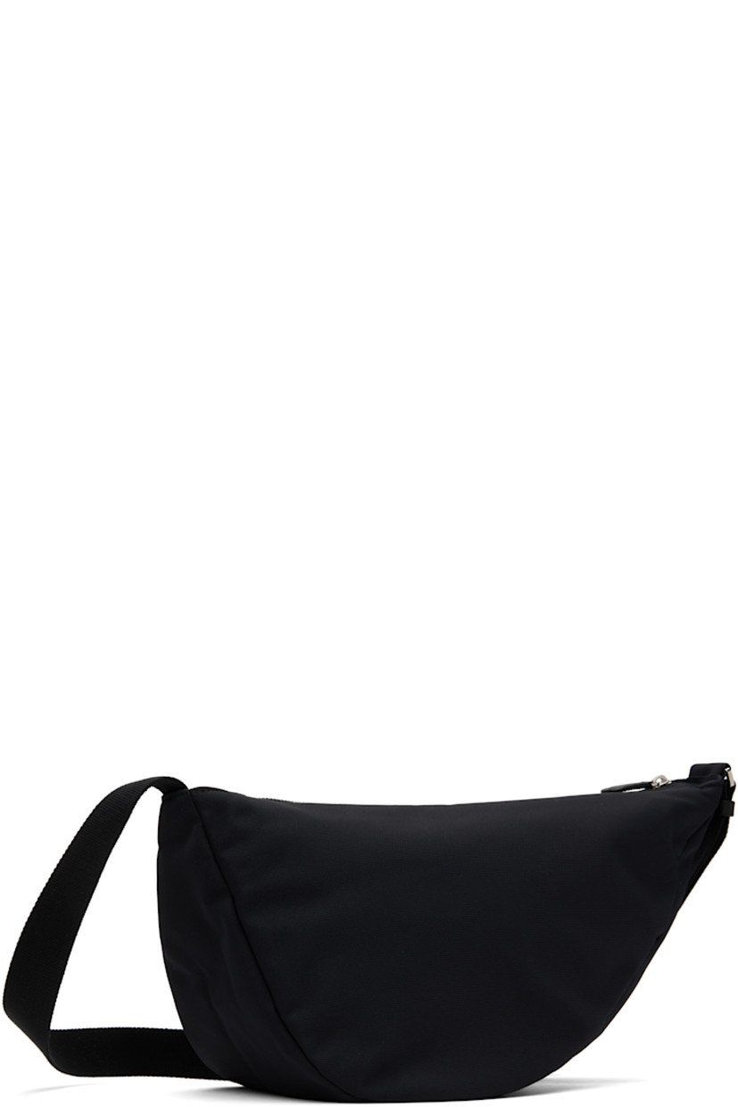 Lightweight nylon- and cotton-blend canvas messenger bag in black.

· Adjustable crossbody strap
· Zip closure
· Fully lined
· H8" x W14" x D6.5"

Supplier color: Black