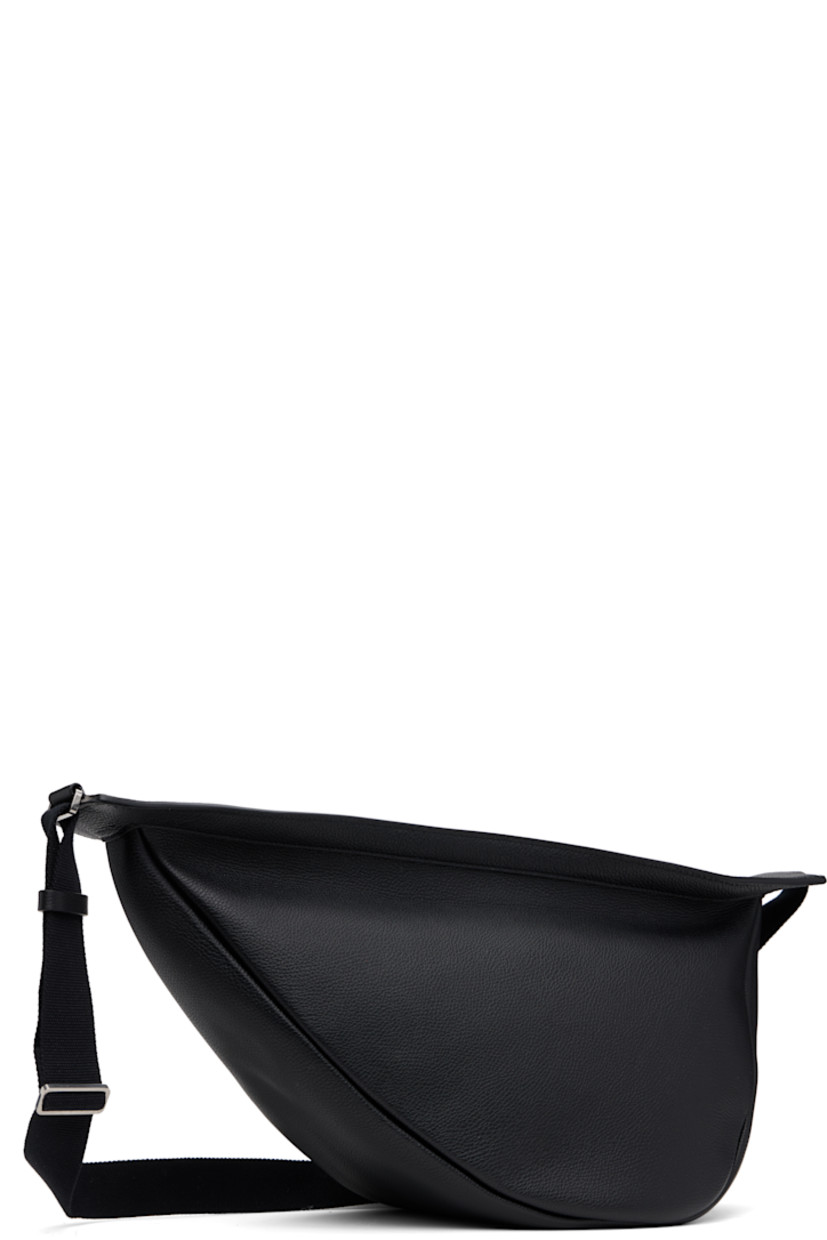 Grained calfskin messenger bag in black.

· Adjustable crossbody strap
· Zip closure
· Suede lining
· H8.5" x W15" x D6.5"

Supplier color: Black