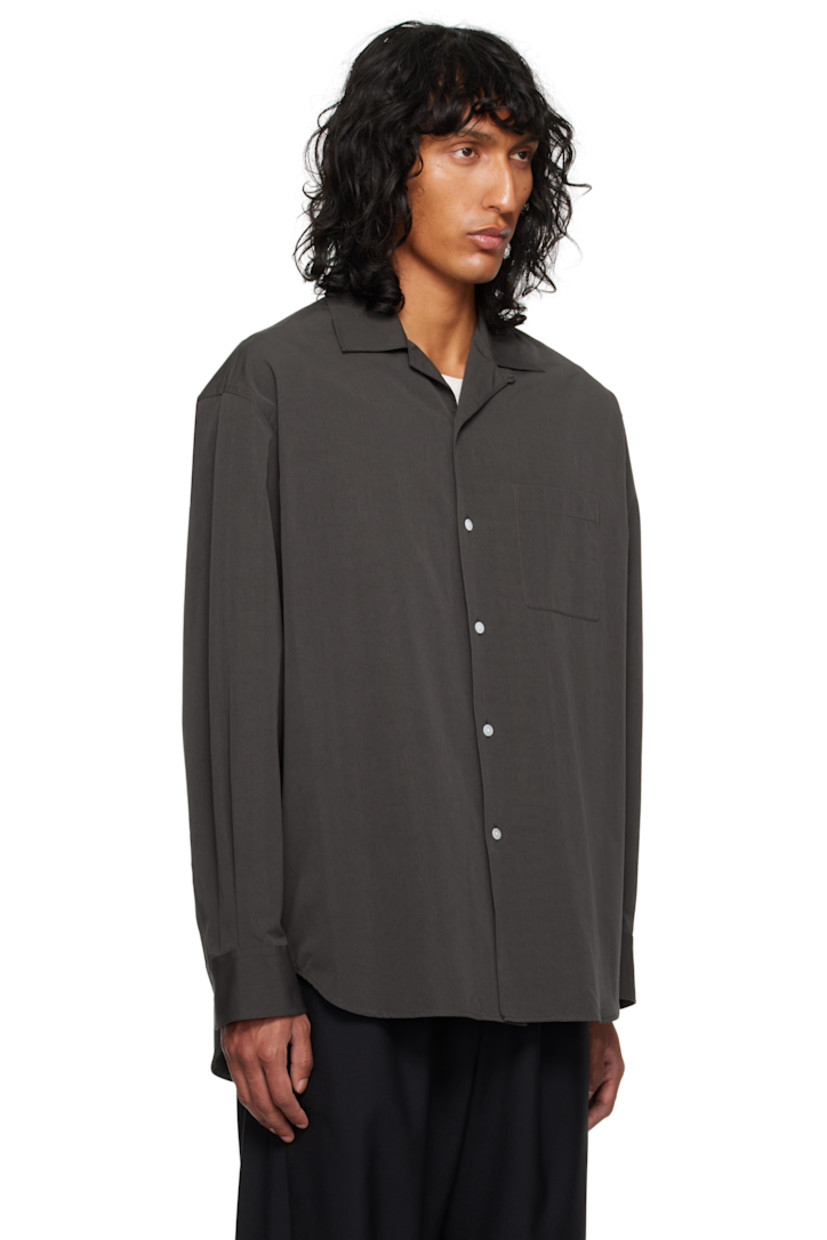 Cotton poplin shirt. 

· Open spread collar
· Button closure
· Patch pocket
· Shirttail hem
· Pleats at single-button barrel cuffs
· Twin pleats at back yoke

Supplier color: Brown