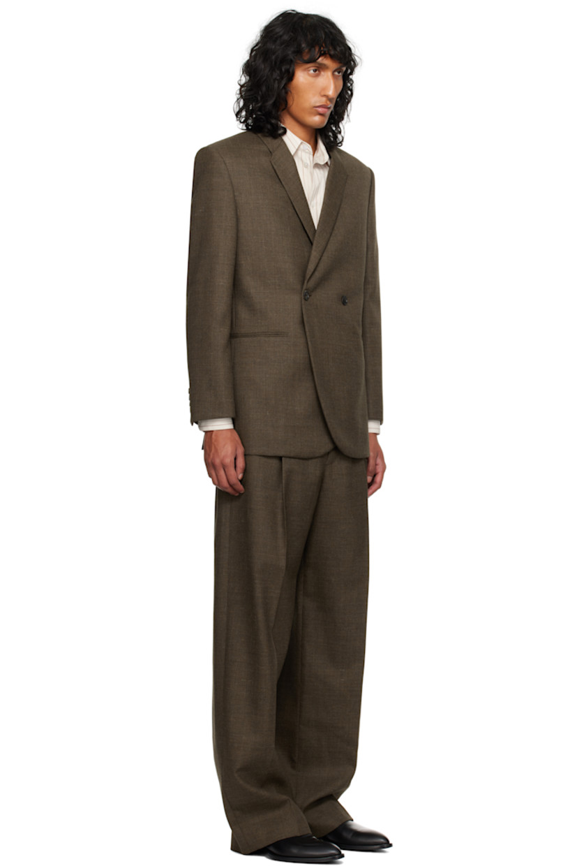 Wool serge blazer.

· Notched lapel
· Button closure
· Welt pockets
· Padded shoulders
· Four-button surgeon's cuffs
· Twin vents at back hem
· Welt pockets at interior
· Silk habotai lining

Supplier color: Brown melange