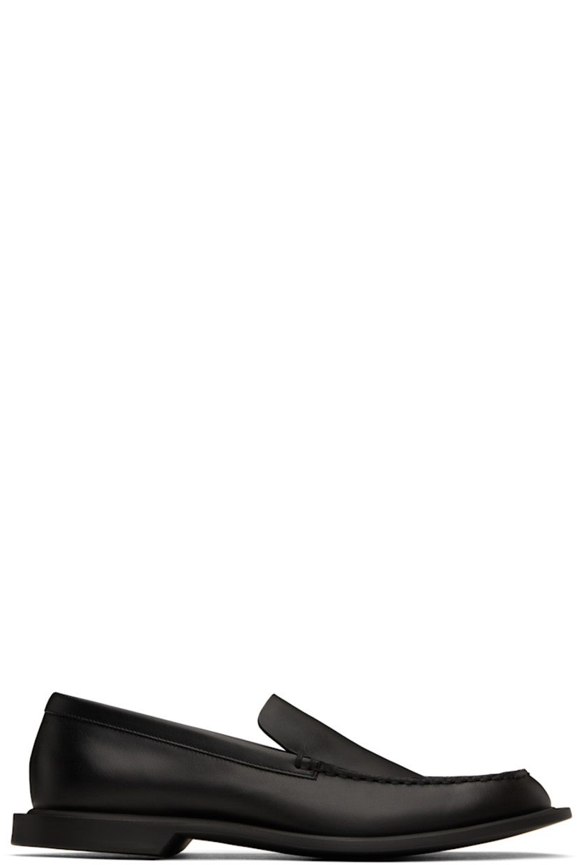 Buffed leather loafers in black. 

· Hand-stitched detailing at moc toe
· Buffed leather lining
· Rubber sole 

Supplier color: Black