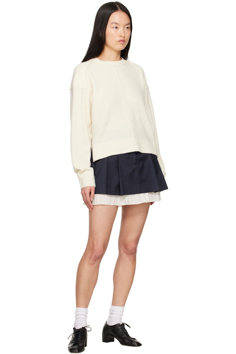 Stretch polyester- and viscose-blend twill miniskirt. Pinstripes throughout. 

· Belt loops
· Three-pocket styling
· Zip fly
· Pleats at front
· Gauze trim at hem
· Partial viscose satin lining

Supplier color: Navy