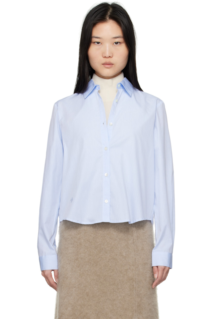 Cotton poplin shirt.

· Spread collar
· Button closure
�· Logo embroidered at front
· Cropped shirttail hem
· Single-button barrel cuffs
· Self-tie straps at vented back

Supplier color: Dusty blue