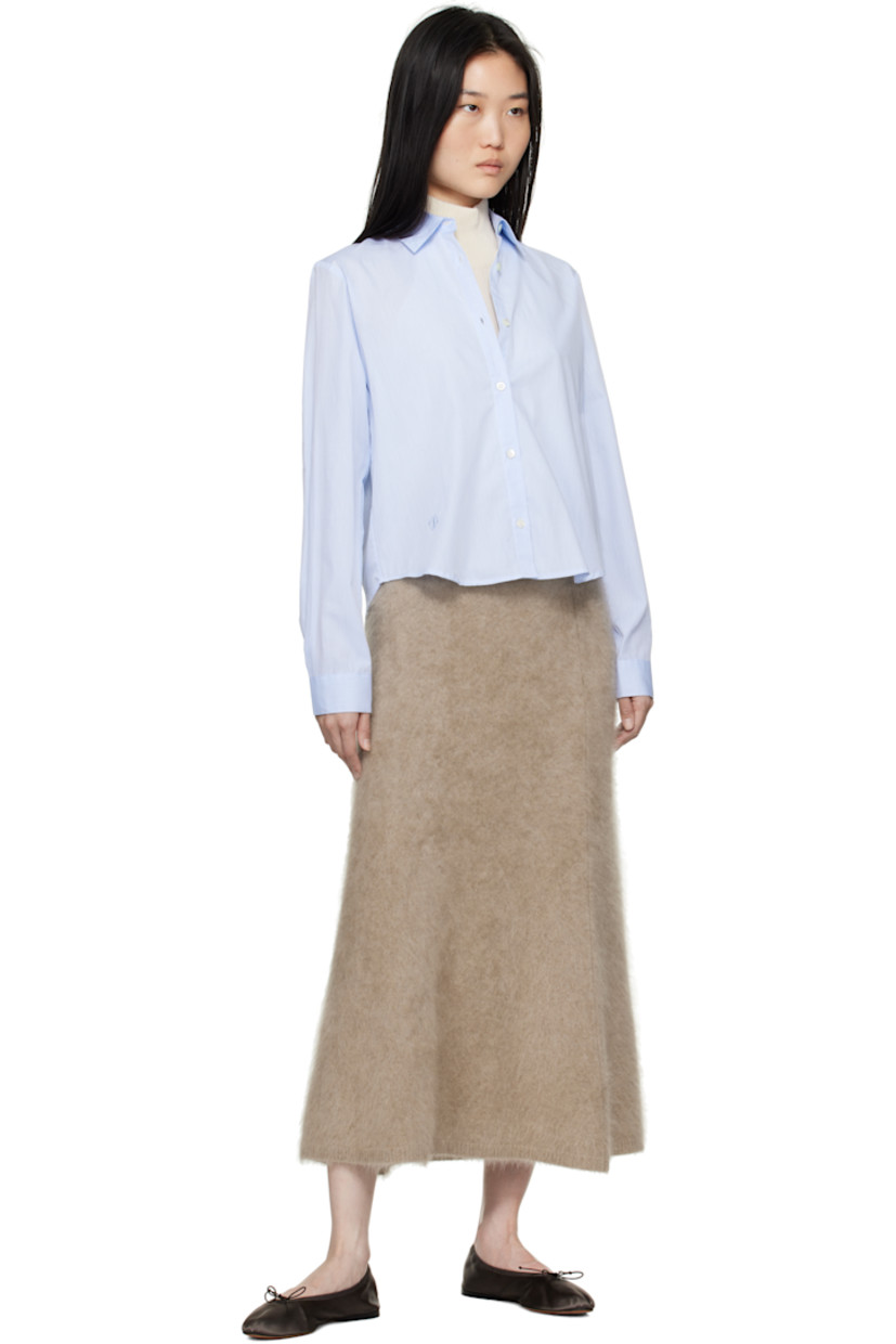 Cotton poplin shirt.

· Spread collar
· Button closure
· Logo embroidered at front
· Cropped shirttail hem
· Single-button barrel cuffs
· Self-tie straps at vented back

Supplier color: Dusty blue