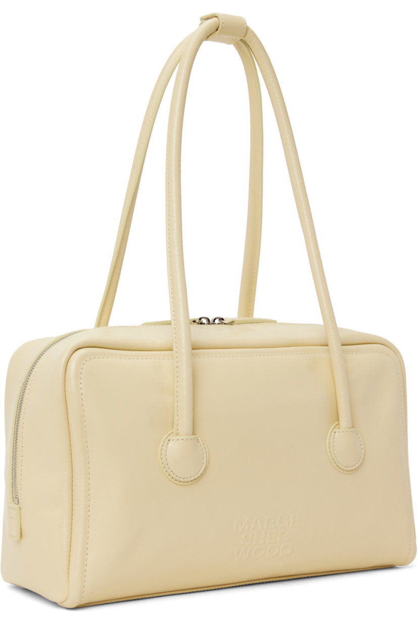 Buffed leather shoulder bag in beige.

· Press-stud tab at rolled shoulder straps
· Logo embossed at face
· Two-way zip closure
· Zip and patch pockets at interior
· Logo-woven twill lining
· H7.5" x W12.5" x D3.5"

Supplier color: Blond wood glossy plain